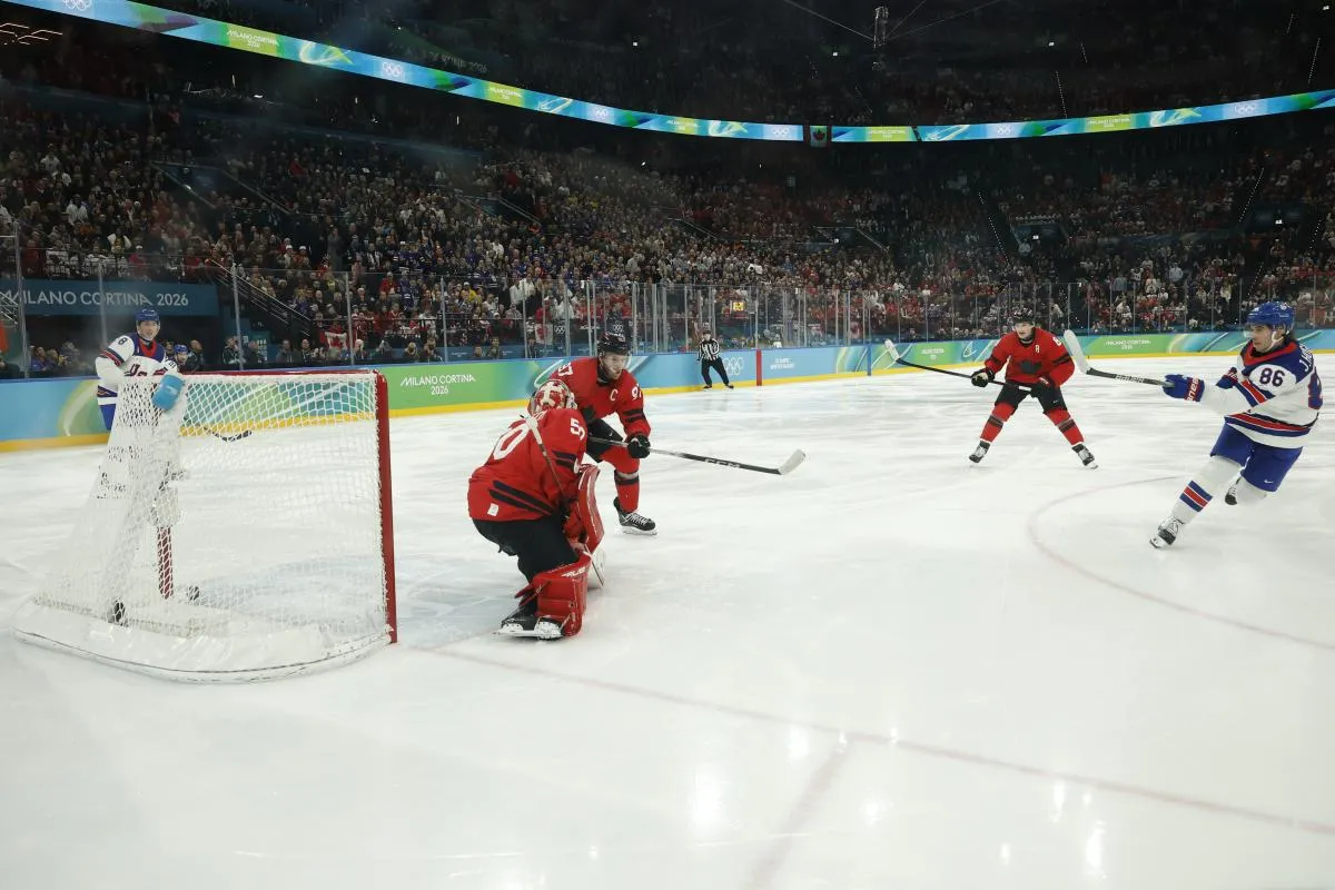 Jack Hughes #86 of Team United States scores the golden goal on Jordan Binnington #50 of Team Canada in overtime during the Milano Cortina 2026 Olympic Winter Games at Milano Santagiulia Ice Hockey Arena.