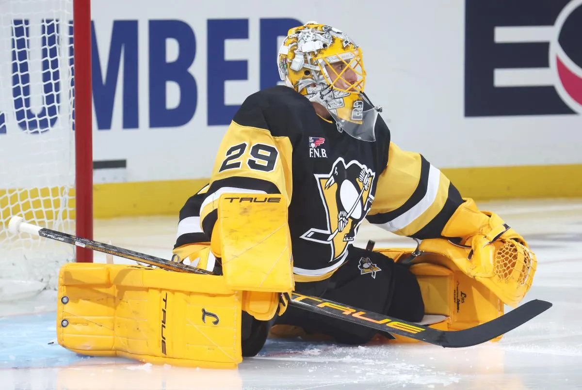 Pittsburgh Penguins goaltender Marc-Andre Fleury (29) stretches on the ice against the Columbus Blue Jackets during the third period at PPG Paints Arena.