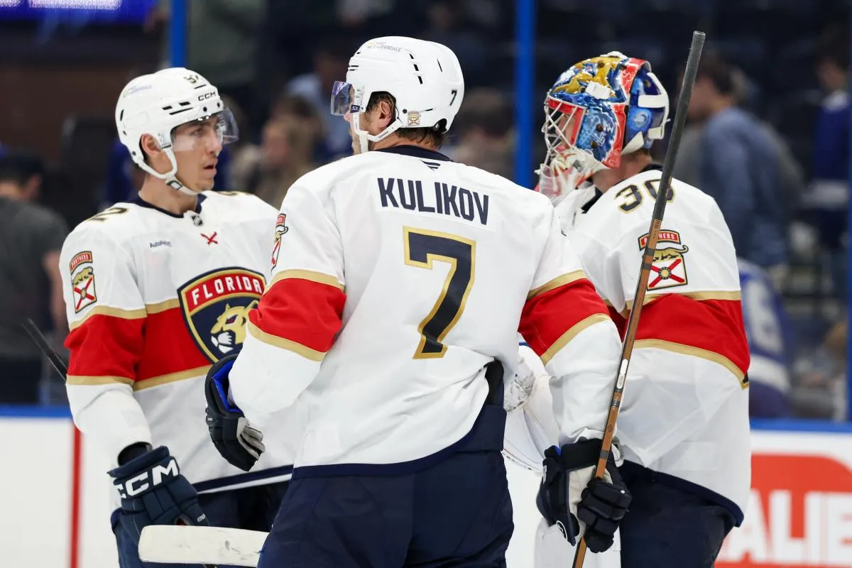 Florida Panthers left wing Tomas Nosek (92) defenseman Niko Mikkola (77) and goaltender Spencer Knight (30) celebrate after beating the Tampa Bay Lightning at Amalie Arena.