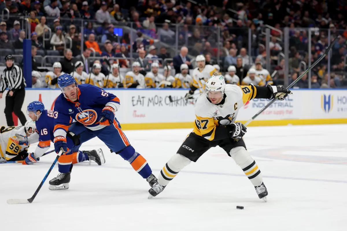 Pittsburgh Penguins center Sidney Crosby (87) winds up for a shot against New York Islanders center Casey Cizikas (53) during the first period at UBS Arena.