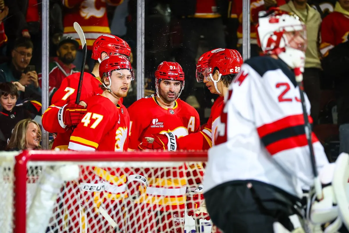 Calgary Flames center Nazem Kadri (91) celebrates his goal with teammates against the New Jersey Devils during the second period at Scotiabank Saddledome.