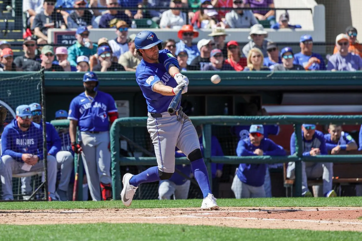Toronto Blue Jays second baseman Ernie Clement (22) triples during the third inning against the Detroit Tigers at Publix Field at Joker Marchant Stadium.