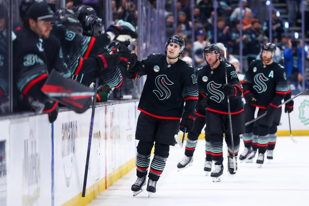 Seattle Kraken left wing Tye Kartye (12) celebrates a goal that is later determined as a no goal in the third period against the Minnesota Wild at Climate Pledge Arena.