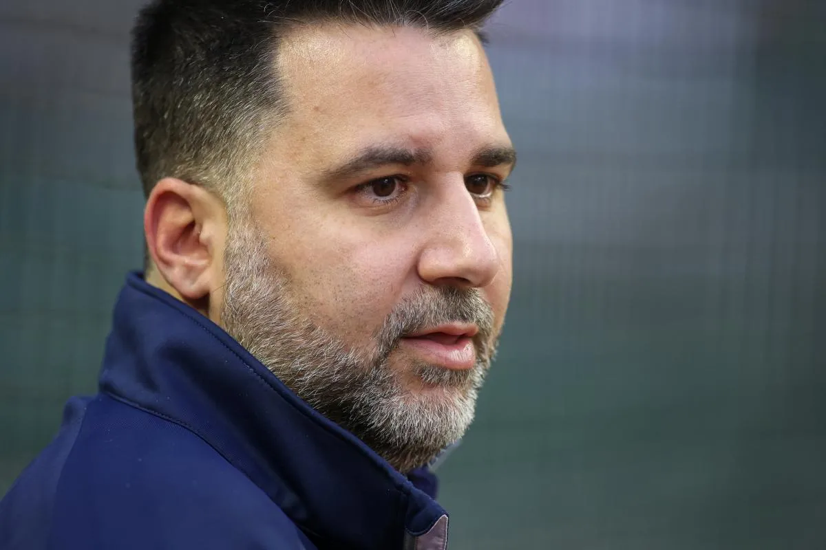 Atlanta Braves general manager Alex Anthopoulos watches a workout before the NLDS against the Philadelphia Phillies at Truist Park.