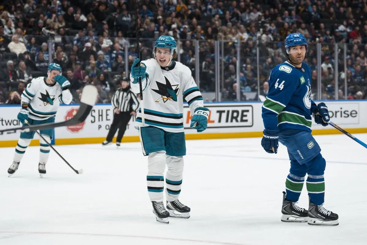 Vancouver Canucks forward Kiefer Sherwood (44) reacts as San Jose Sharks forward Macklin Celebrini (71) celebrates his goal in the third period at Rogers Arena.