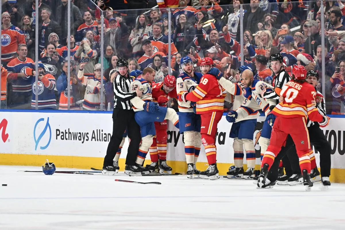 Edmonton Oilers right winger Vasily Podkolzin (92) Calgary Flames (43) and right winger Adam Klapka get mixed up with Oilers defenseman Alec Regula (75) and Flames center John Beecher (18) in a brawl during the third period at Rogers Place.