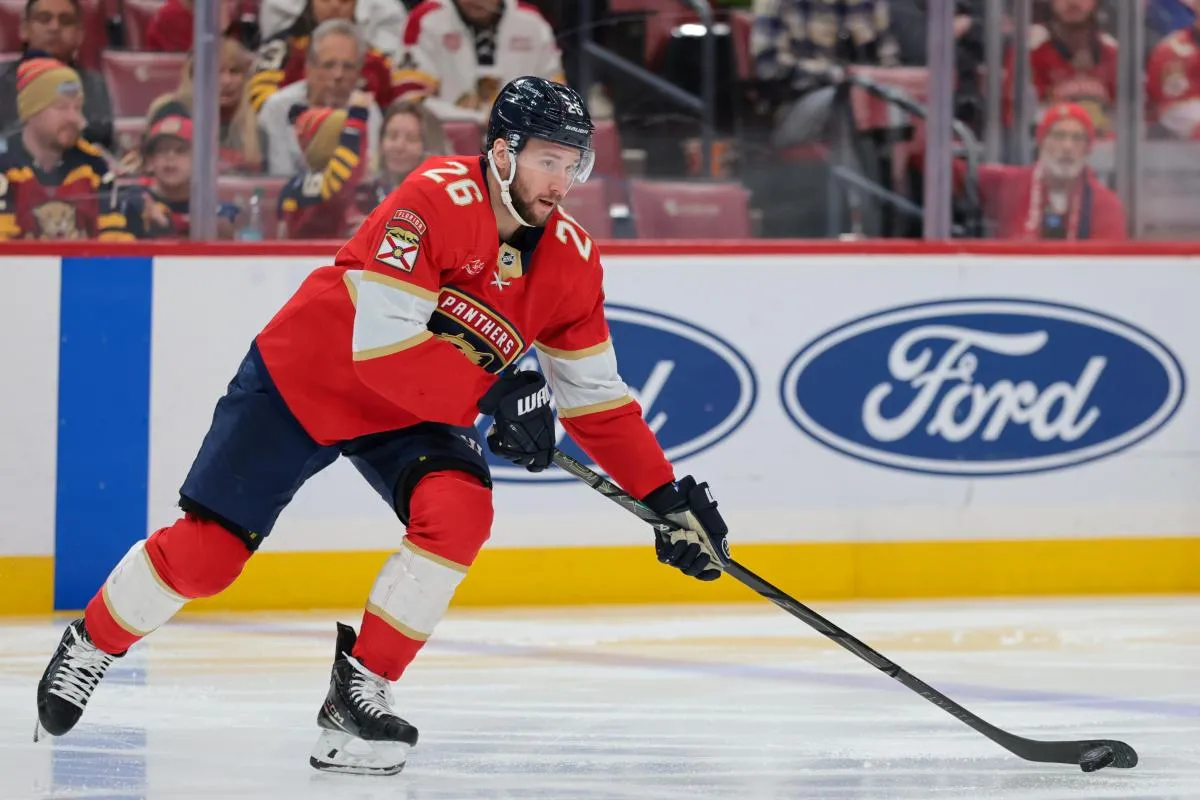 Florida Panthers defenseman Uvis Balinskis (26) moves the puck against the Winnipeg Jets during the second period at Amerant Bank Arena