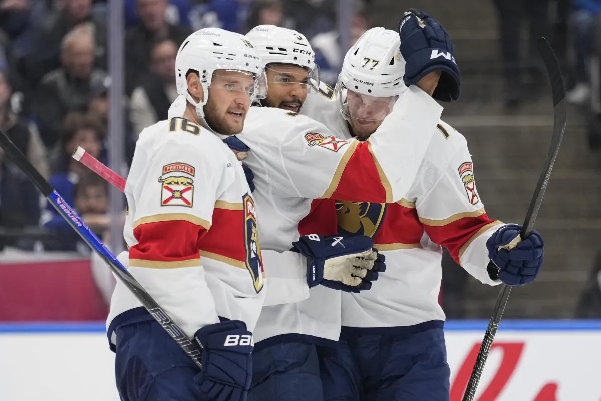 Florida Panthers defenseman Seth Jones (3) celebrates his goal against the Toronto Maple Leafs with Florida Panthers forward Aleksander Barkov (16) and defenseman Niko Mikkola (77) during the second period of game seven of the second round of the 2025 Stanley Cup Playoffs at Scotiabank Arena.