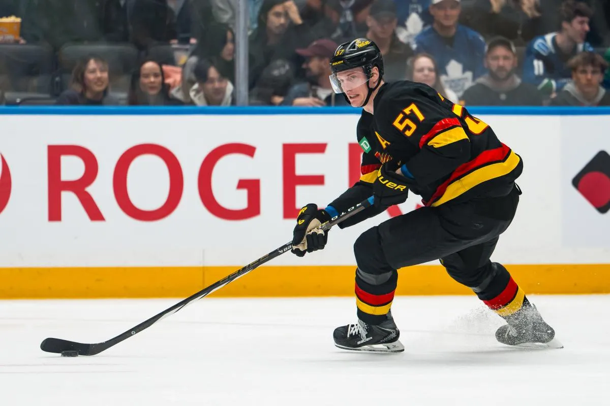 Vancouver Canucks defenseman Tyler Myers (57) handles the puck against the Toronto Maple Leafs in the first period at Rogers Arena