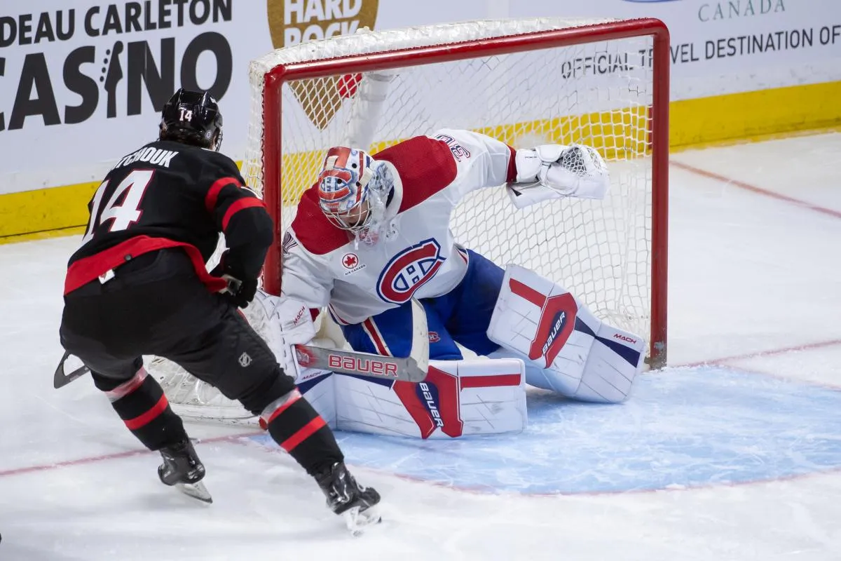 Montreal Canadiens goalie Cayden Primeau (30) makes a save on a shot from Ottawa Senators left wing Boris Katchouk (14) in the third period at the Canadian Tire Centre