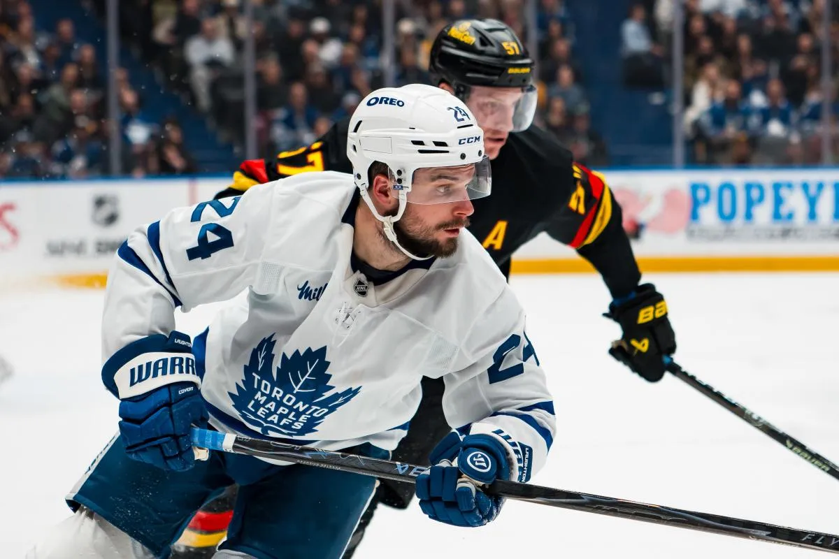 Vancouver Canucks defenseman Tyler Myers (57) defends against Toronto Maple Leafs forward Scott Laughton (24) in the third period at Rogers Arena