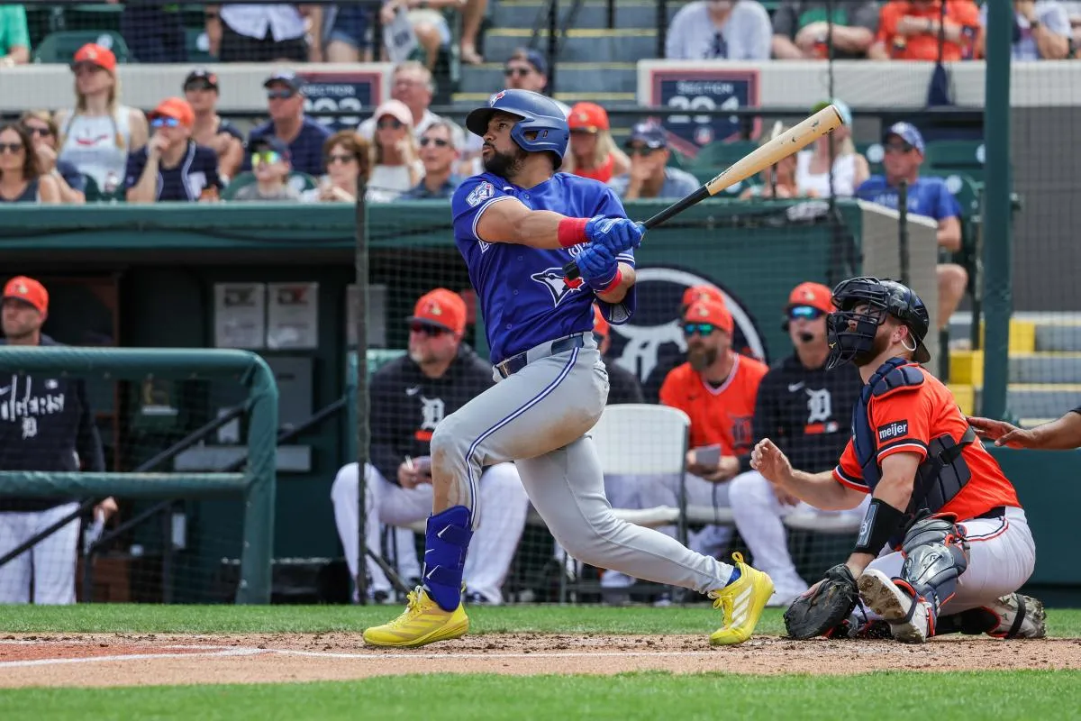 Toronto Blue Jays left fielder Jonatan Clase (8) hits a two run double during the third inning against the Detroit Tigers at Publix Field at Joker Marchant Stadium.