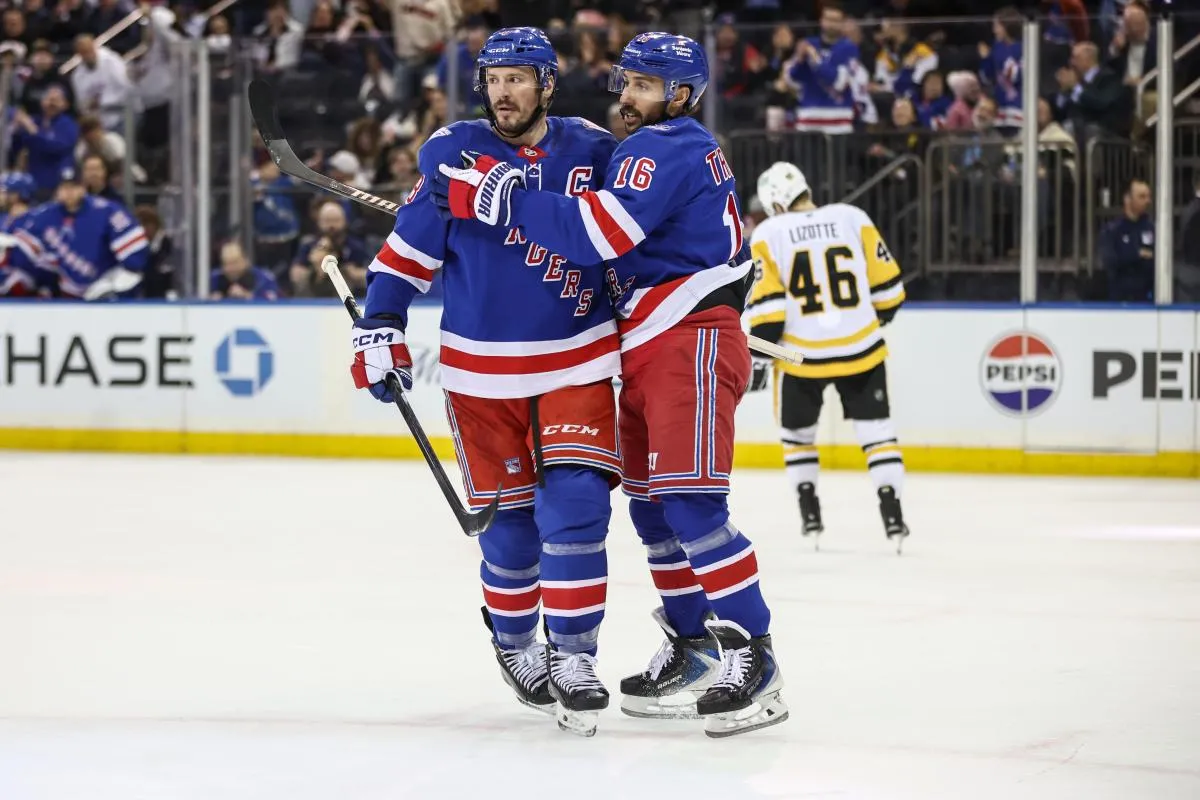 New York Rangers centers J.T. Miller (8) and Vincent Trocheck (16) celebrate in the second period against the Pittsburgh Penguins at Madison Square Garden.