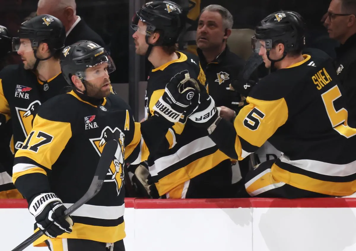 Pittsburgh Penguins right wing Bryan Rust (17) celebrates his goal with the Penguins bench against the Vegas Golden Knights during the second period at PPG Paints Arena.