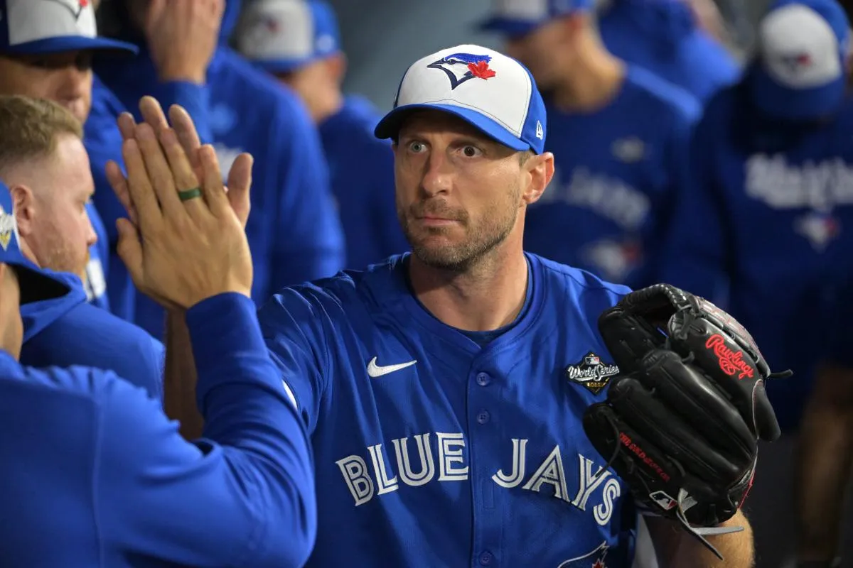 Toronto Blue Jays pitcher Max Scherzer (31) reacts in the dugout after being relieved in the fifth inning against the Los Angeles Dodgers during game three of the 2025 MLB World Series at Dodger Stadium.