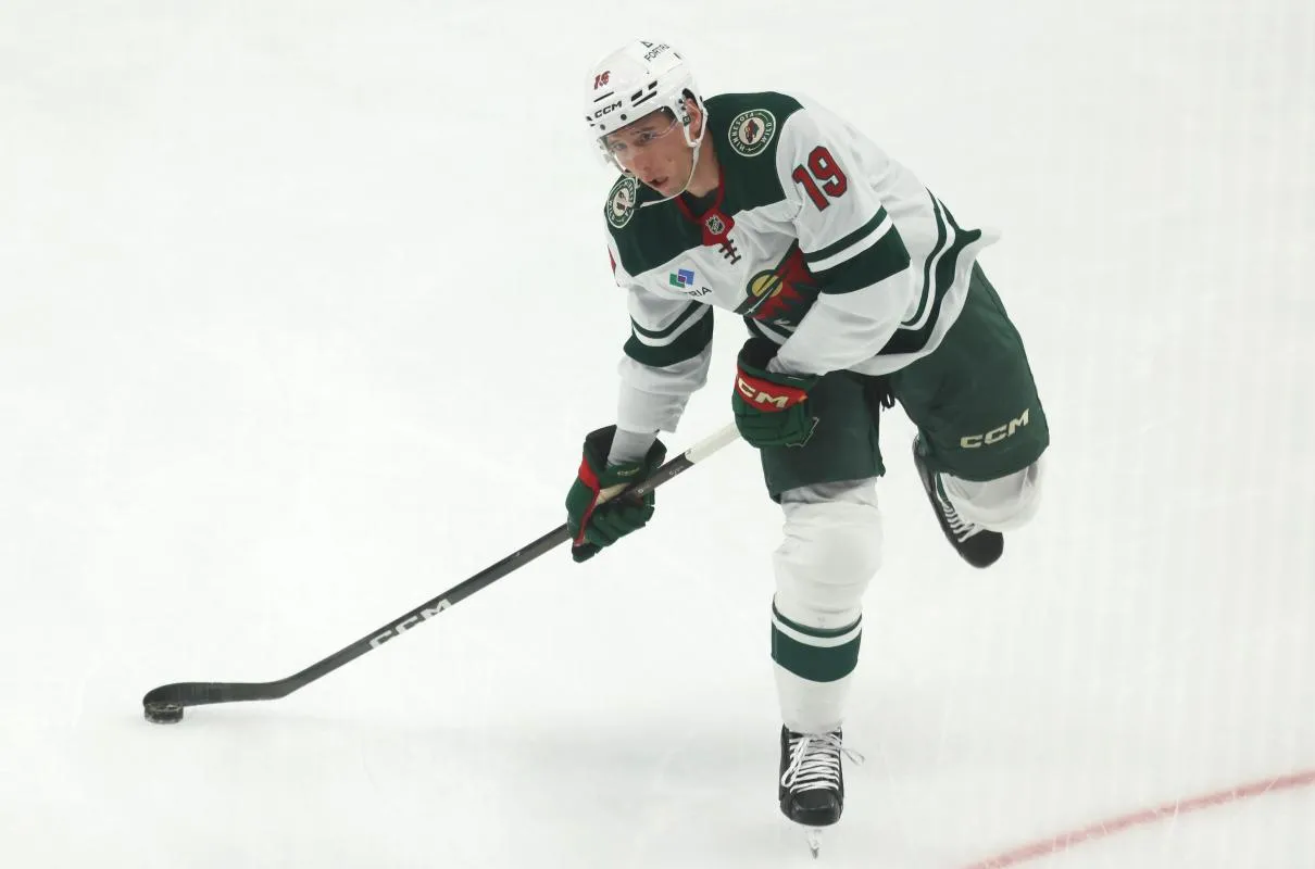 Minnesota Wild center Tyler Pitlick (19) warms up before the game against the Pittsburgh Penguins at PPG Paints Arena.