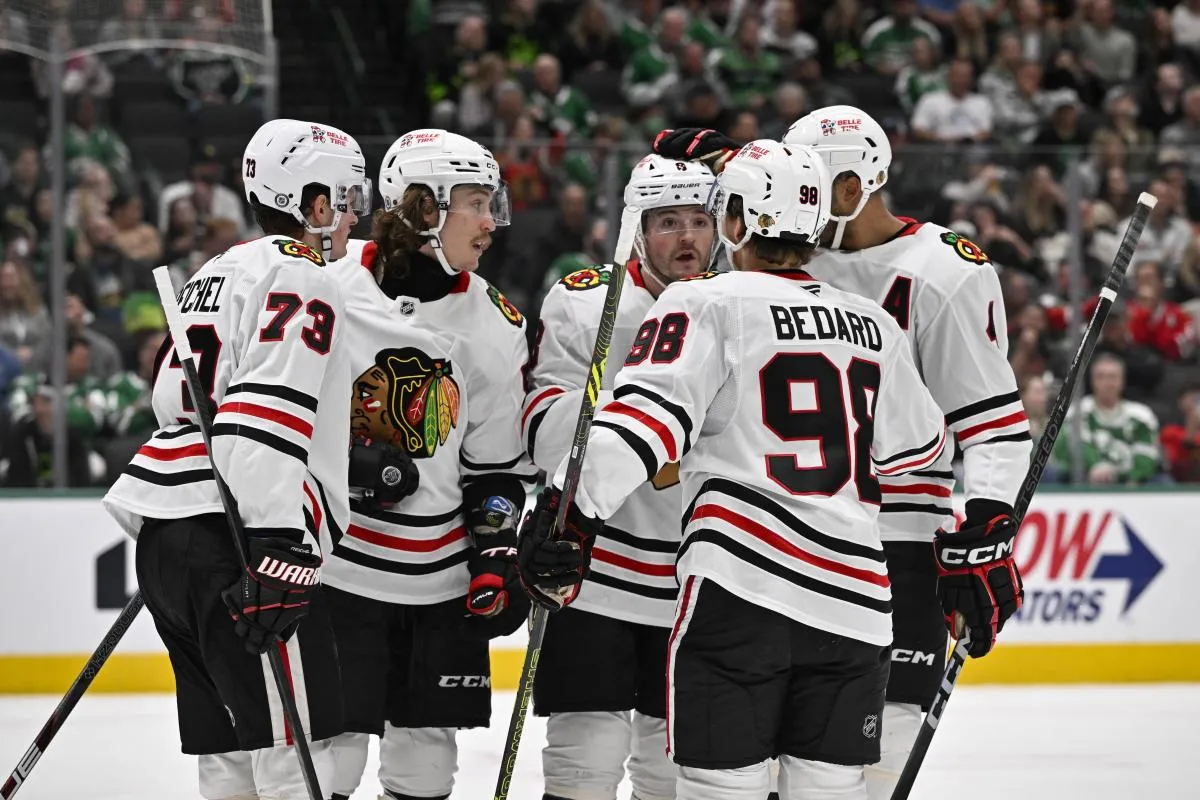 Chicago Blackhawks left wing Tyler Bertuzzi (59) and left wing Lukas Reichel (73) and center Connor Bedard (98) and center Ryan Donato (8) and defenseman Connor Murphy (5) celebrates a goal scored by Bertuzzi against the Dallas Stars during the third period at the American Airlines Center.