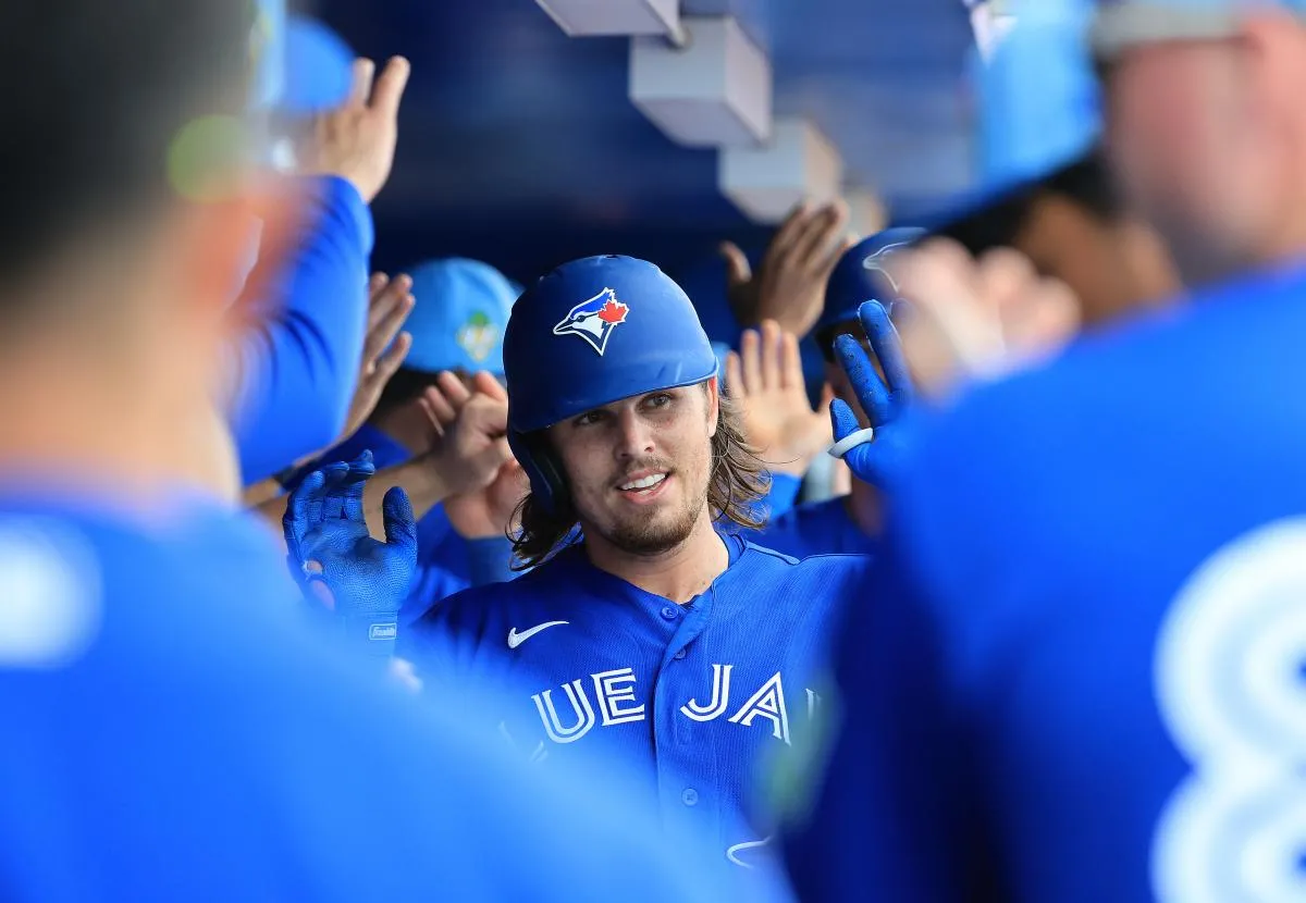 Dunedin, Florida, USA;Toronto Blue Jays third baseman Addison Barger (47) is congratulated in the dugout after he hit a grand slam during the fifth inning against the Boston Red Sox at TD Ballpark.