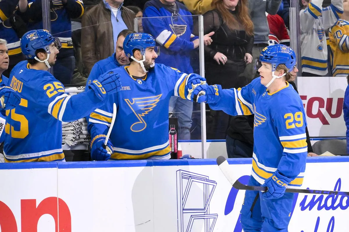 St. Louis Blues right wing Jonatan Berggren (29) is congratulated by center Robby Fabbri (9) and right wing Jordan Kyrou (25) after scoring against the Montreal Canadiens during the first period at Enterprise Center.