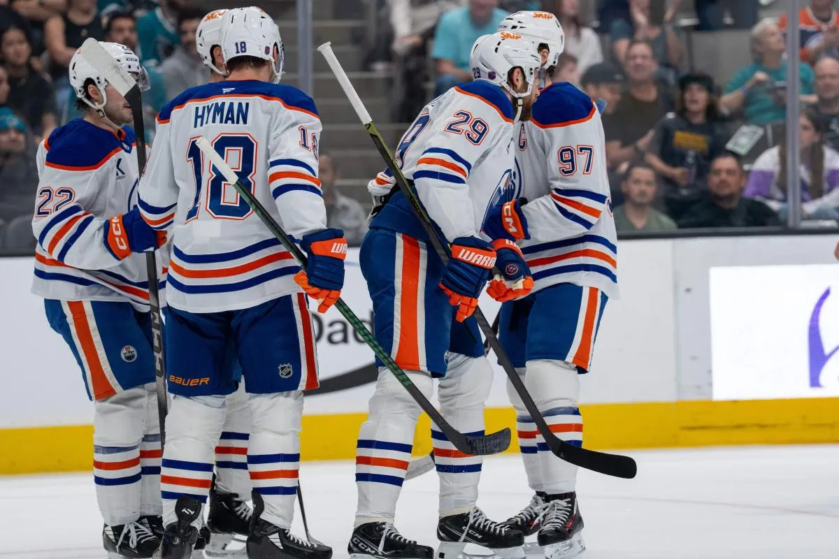 Edmonton Oilers center Leon Draisaitl (29) and Edmonton Oilers center Connor McDavid (97) and Edmonton Oilers left wing Zach Hyman (18) and Edmonton Oilers center Matt Savoie (22) celebrate after the goal against the San Jose Sharks during the first period at SAP Center at San Jose.