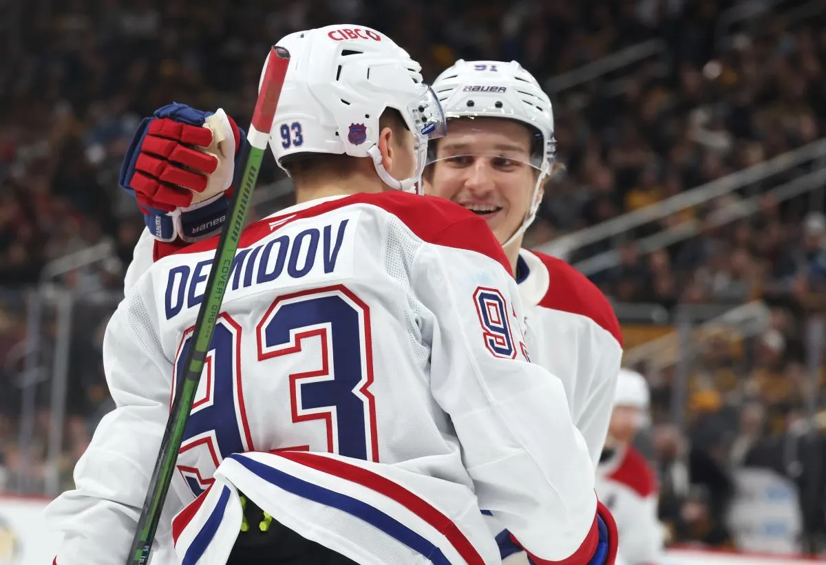 Montreal Canadiens center Oliver Kapanen (91) congratulates right wing Ivan Demidov (93) on his goal against the Pittsburgh Penguins during the second period at PPG Paints Arena.