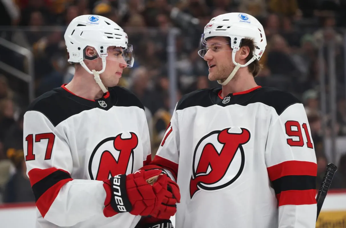 New Jersey Devils defenseman Simon Nemec (17) and center Dawson Mercer (91) talk on the ice against the Pittsburgh Penguins during the first period at PPG Paints Arena.