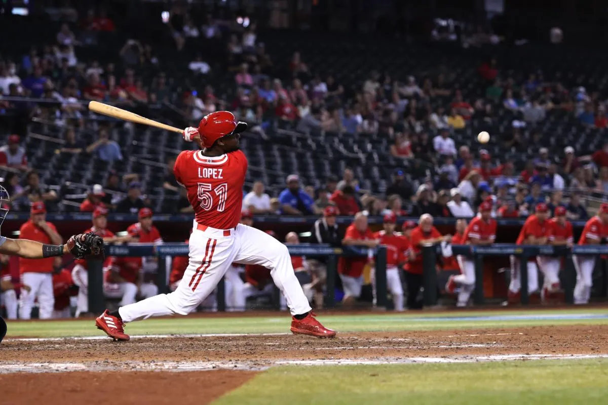 Team Canada Otto Lopez (51) gets a hit against Team Canada at Chase Field.