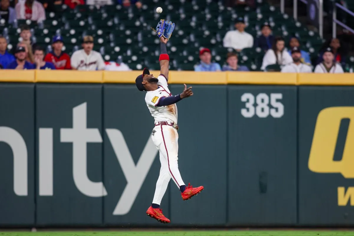 Atlanta Braves left fielder Jurickson Profar (7) jumps for a ball against the Milwaukee Brewers in the sixth inning at Truist Park.