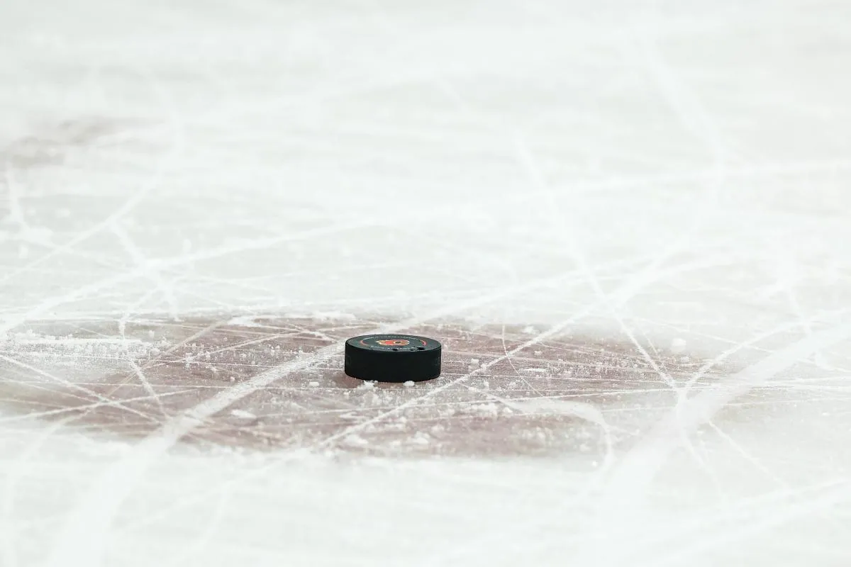 General view of the puck during the third period between the Calgary Flames and the Edmonton Oilers at Scotiabank Saddledome.