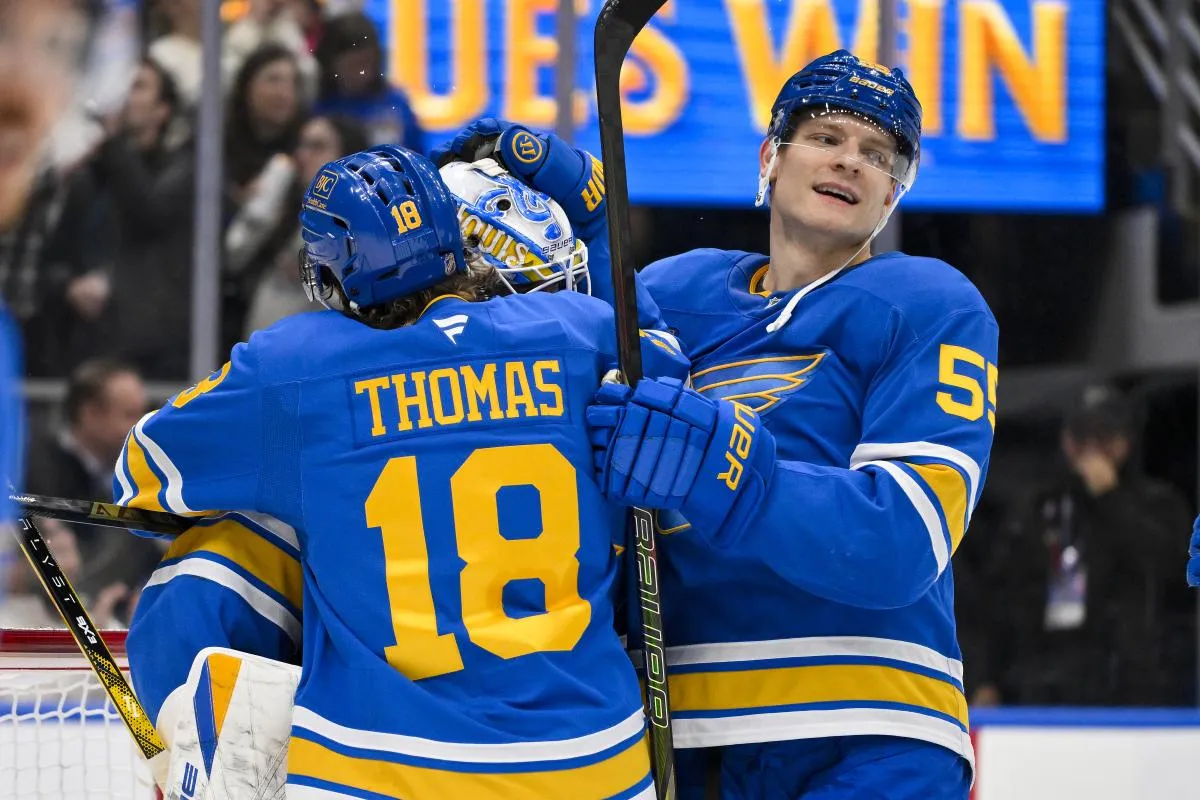 St. Louis Blues goaltender Jordan Binnington (50) center Robert Thomas (18) and defenseman Colton Parayko (55) celebrate after the Blues defeated the Calgary Flames at Enterprise Center.