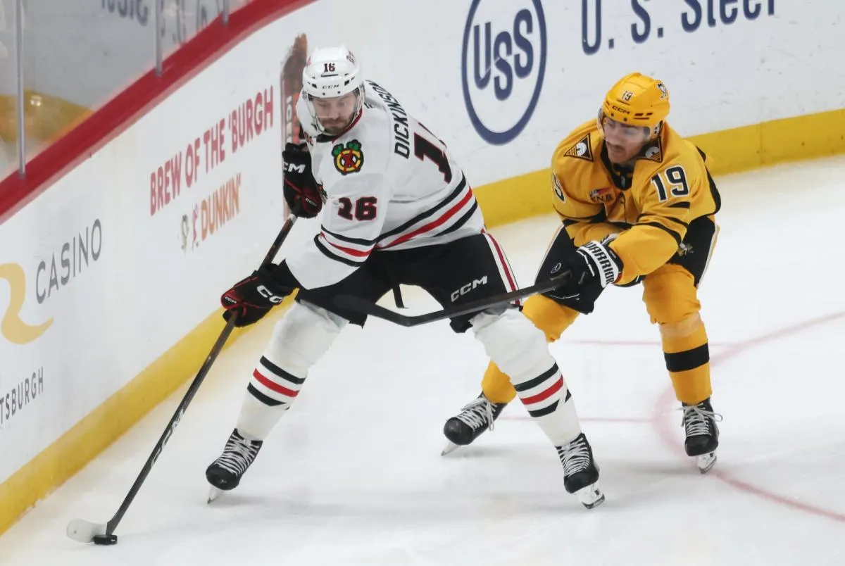 Chicago Blackhawks center Jason Dickinson (16) moves the puck against Pittsburgh Penguins center Blake Lizotte (46) during the third period at PPG Paints Arena.