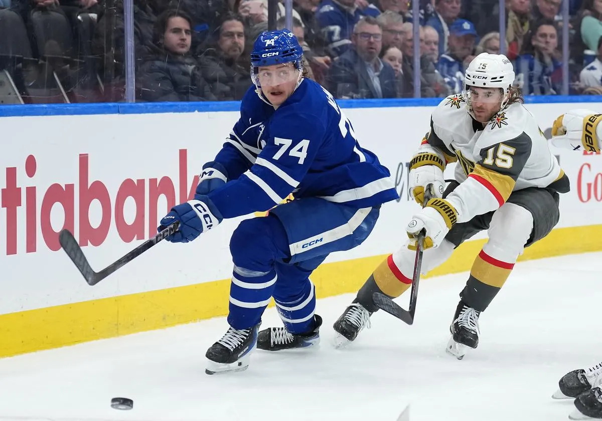 Toronto Maple Leafs center Bobby McMann (74) battles for the puck with Vegas Golden Knights defenseman Noah Hanifin (15) during the third period at Scotiabank Arena.