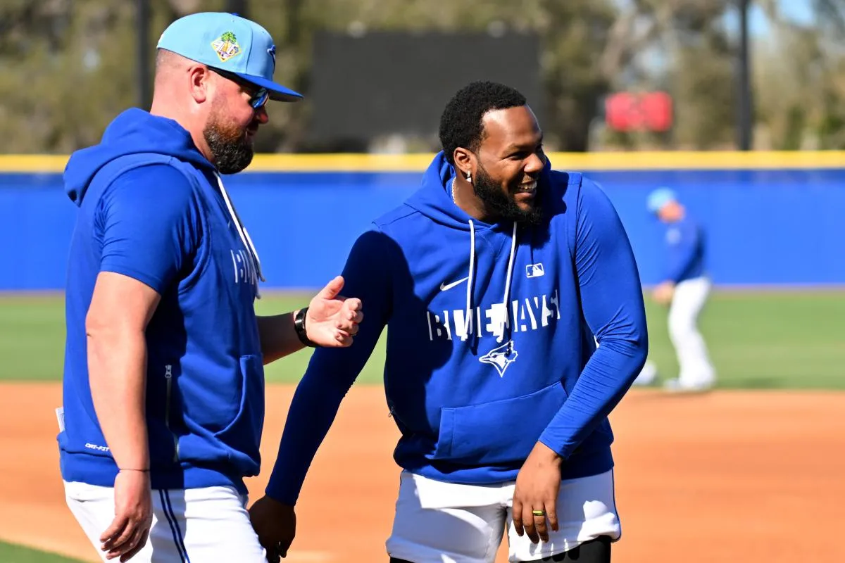 Toronto Blue Jays infielder Vladimir Guerrero Jr. (27) talks with manager John Schneider (14) during spring training at Bobby Mattick Training Center at Englebert Complex.