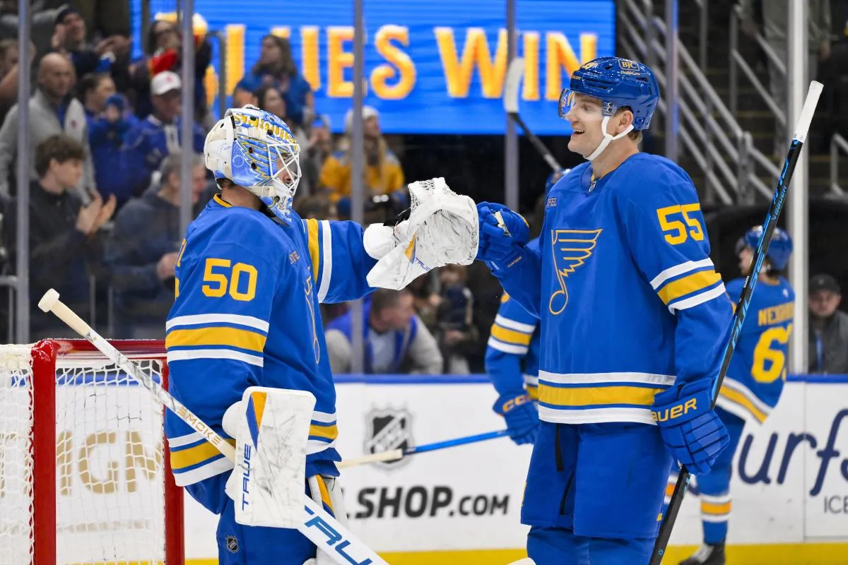 St. Louis Blues goaltender Jordan Binnington (50) celebrates with defenseman Colton Parayko (55) after recording a shutout in a victory over the Montreal Canadiens at Enterprise Center.