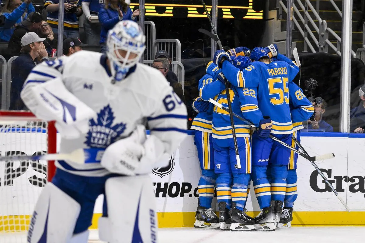 St. Louis Blues center Jordan Kyrou (25) celebrates with center Brayden Schenn (10) center Dylan Holloway (81) and defenseman Ryan Suter (22) and defenseman Colton Parayko (55) after scoring against Toronto Maple Leafs goaltender Joseph Woll (60) during the second period at Enterprise Center.