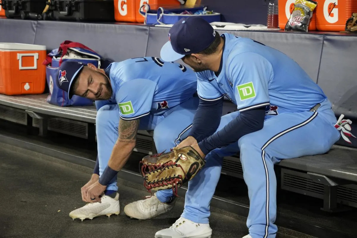 Toronto Blue Jays right fielder Nathan Lukes (38) and center fielder Daulton Varsho (5) talk in the dugout before game six of the 2025 MLB World Series against the Los Angeles Dodgers at Rogers Centre.