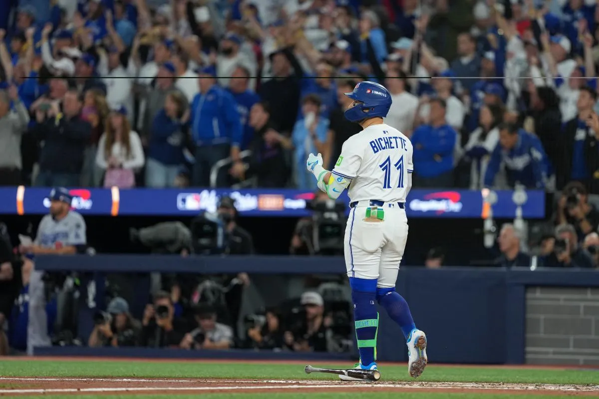 Toronto Blue Jays shortstop Bo Bichette (11) reacts after hitting a three run home run against the Los Angeles Dodgers in the third inning for game seven of the 2025 MLB World Series at Rogers Centre.
