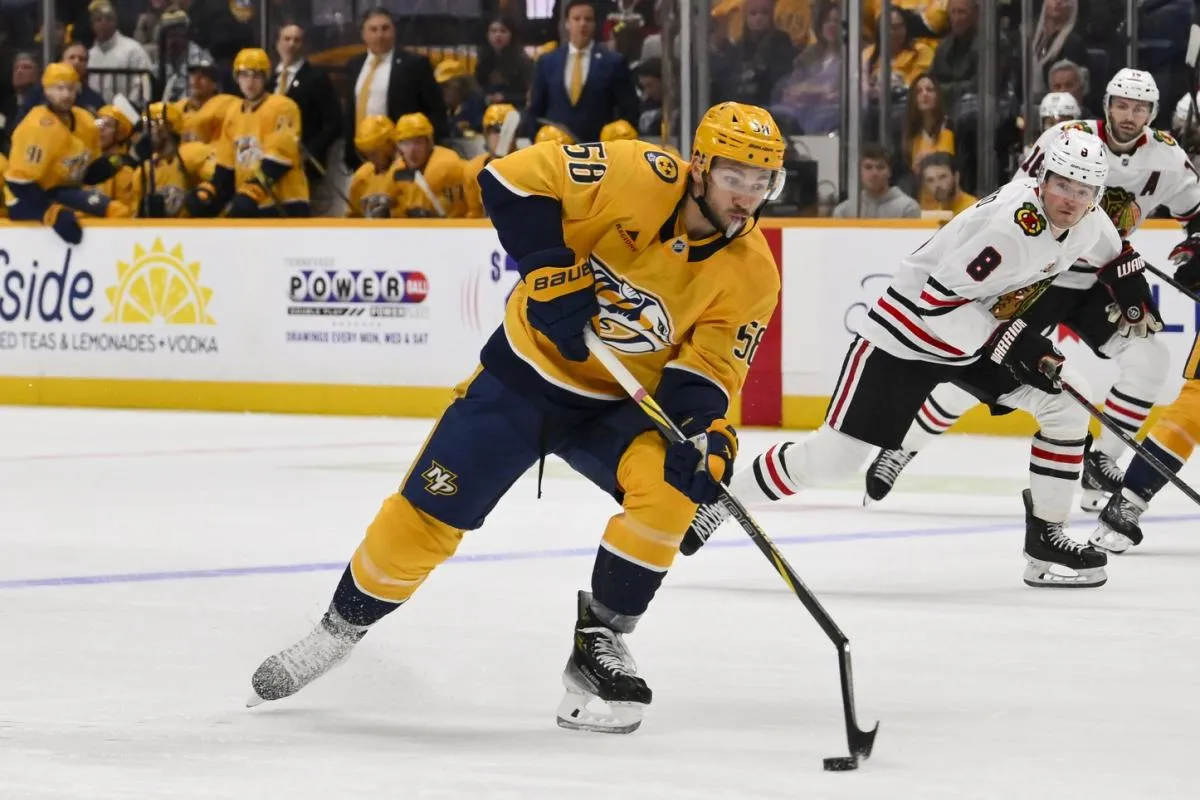 Nashville Predators left wing Michael Bunting (58) breaks his stick against the Chicago Blackhawks during the first period at Bridgestone Arena.