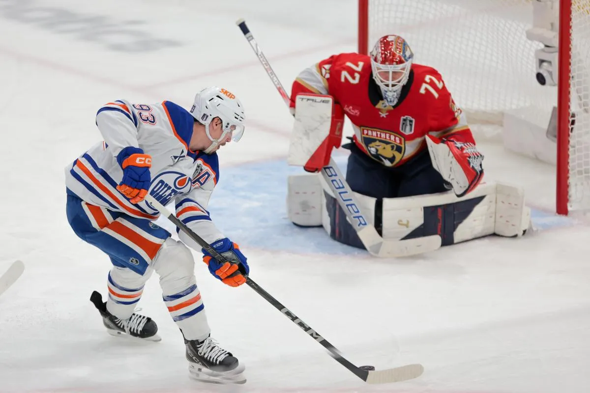 Edmonton Oilers center Ryan Nugent-Hopkins (93) controls the puck as Florida Panthers goaltender Sergei Bobrovsky (72) defends the net during the second period in game six of the 2025 Stanley Cup Final at Amerant Bank Arena.