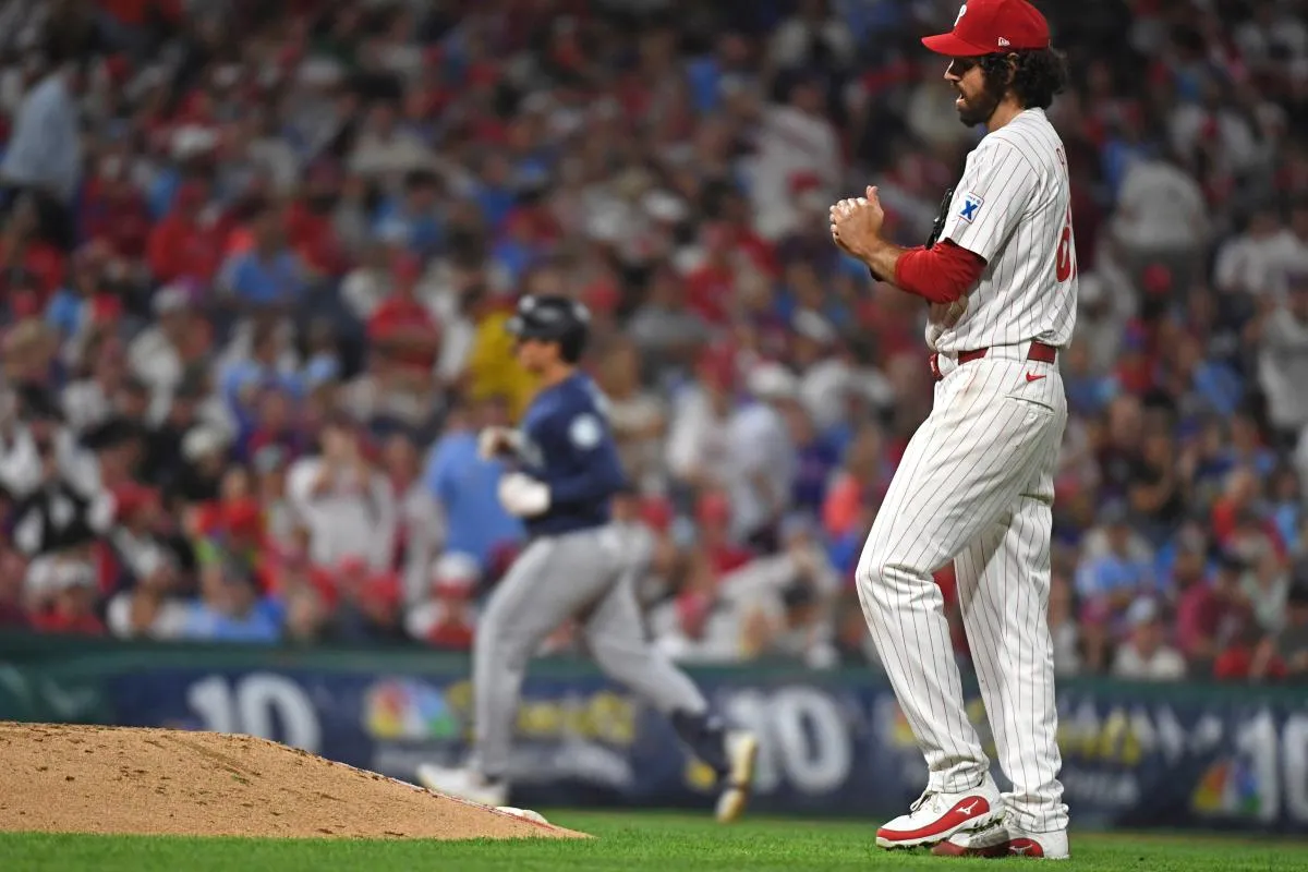 Philadelphia Phillies pitcher Jordan Romano (68) gets a new baseball after allowing a home run during the seventh inning against the Seattle Mariners at Citizens Bank Park.