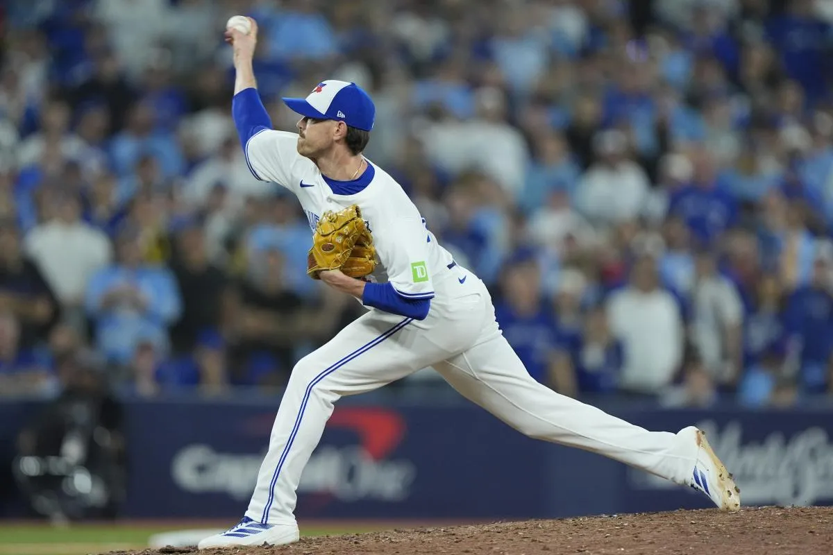 Toronto Blue Jays pitcher Shane Bieber (57) pitches against the Los Angeles Dodgers in the eleventh inning during game seven of the 2025 MLB World Series at Rogers Centre.