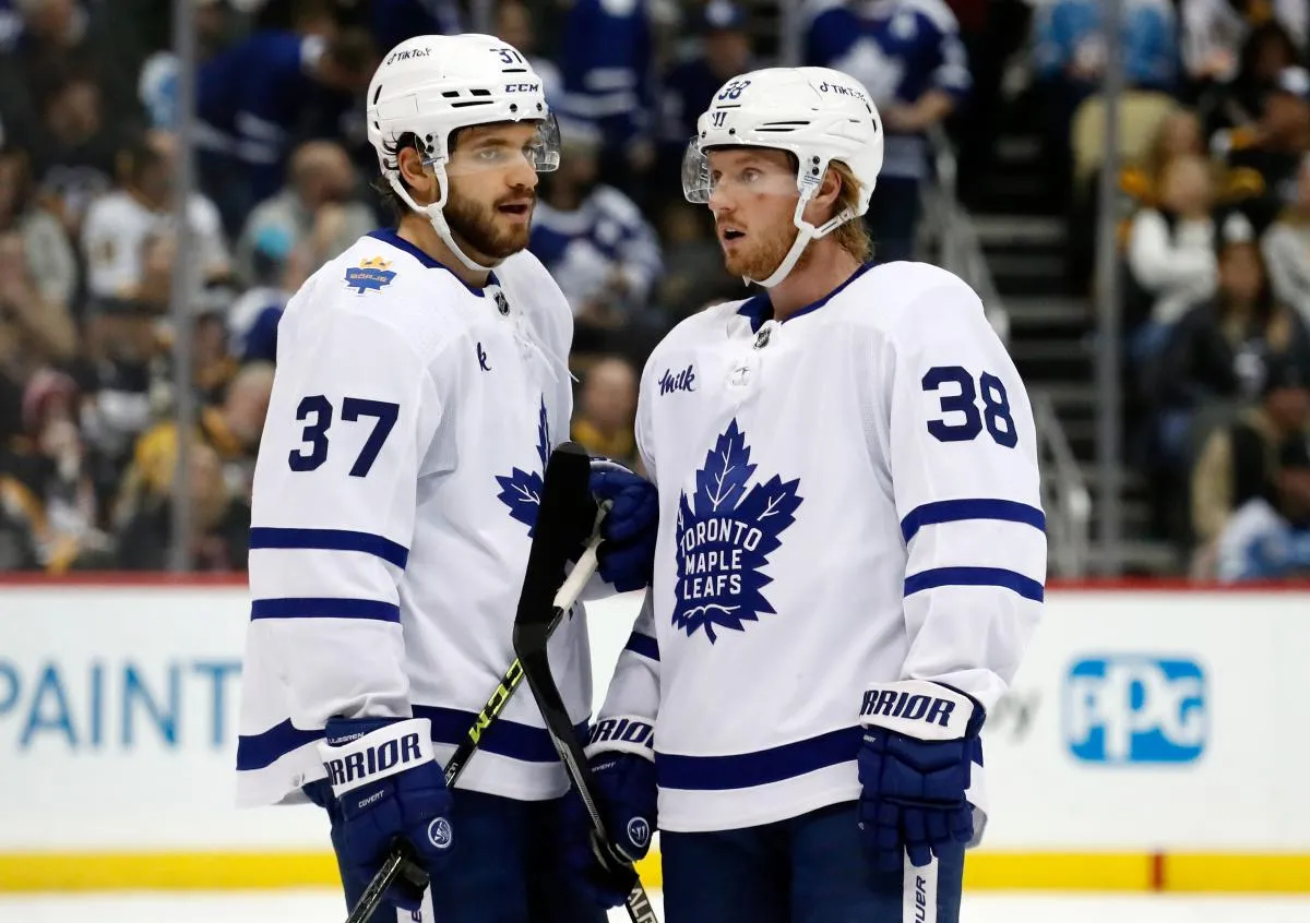 Toronto Maple Leafs defensemen Timothy Liljegren (37) and Rasmus Sandin (38) talk before a face-off against the Pittsburgh Penguins during the second period at PPG Paints Arena.