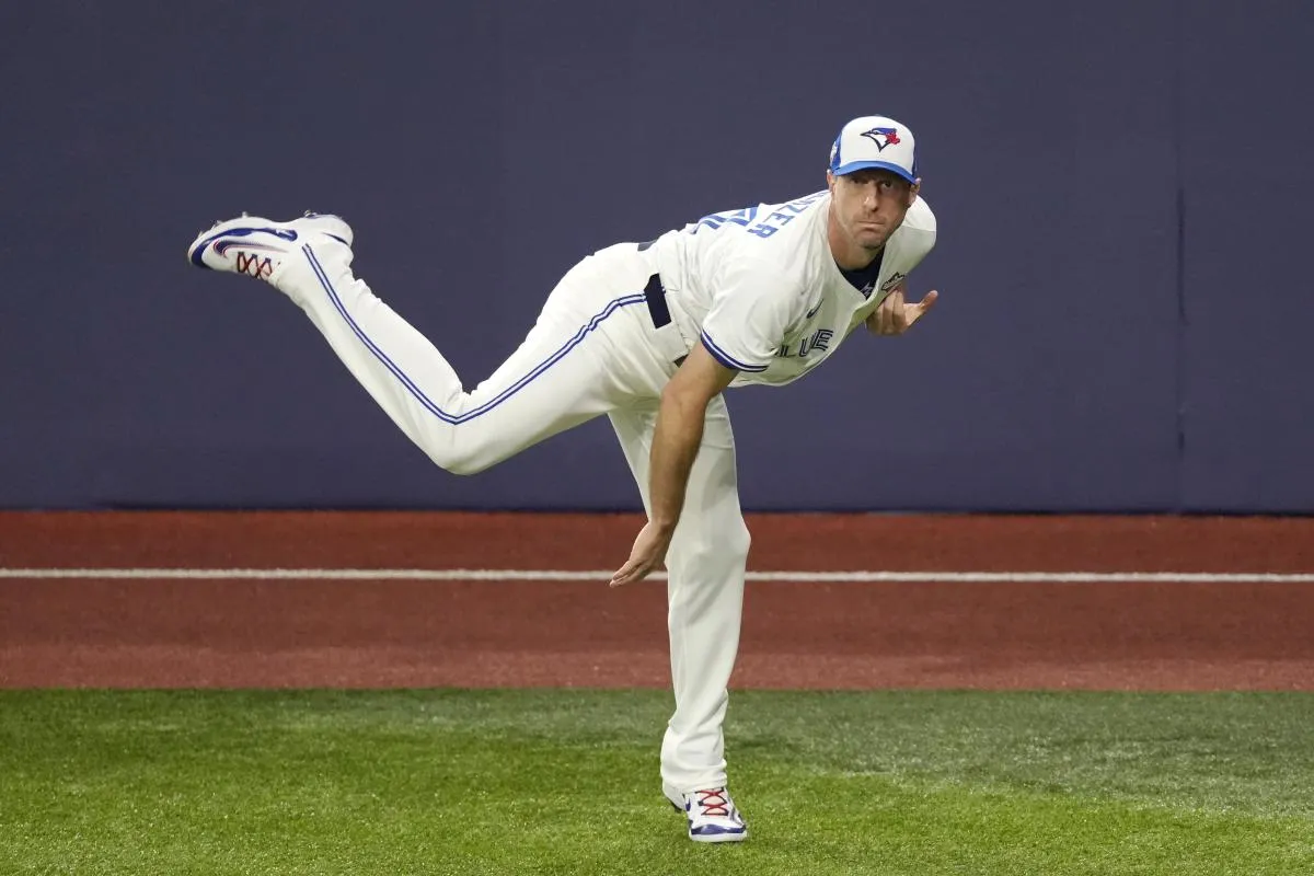 Toronto Blue Jays pitcher Max Scherzer (31) warms up before game seven of the 2025 MLB World Series against the Los Angeles Dodgers at Rogers Centre.