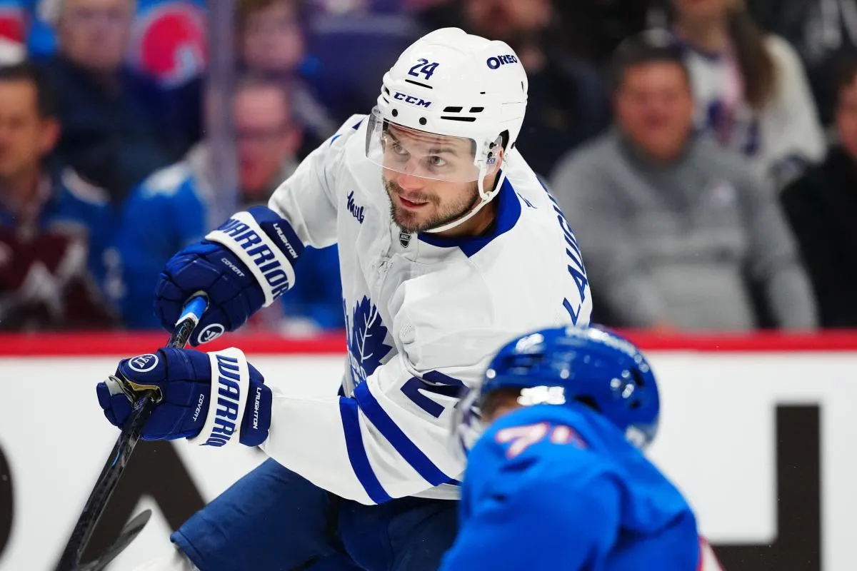 Toronto Maple Leafs center Scott Laughton (24) takes a shot on goal in the first period at Ball Arena.