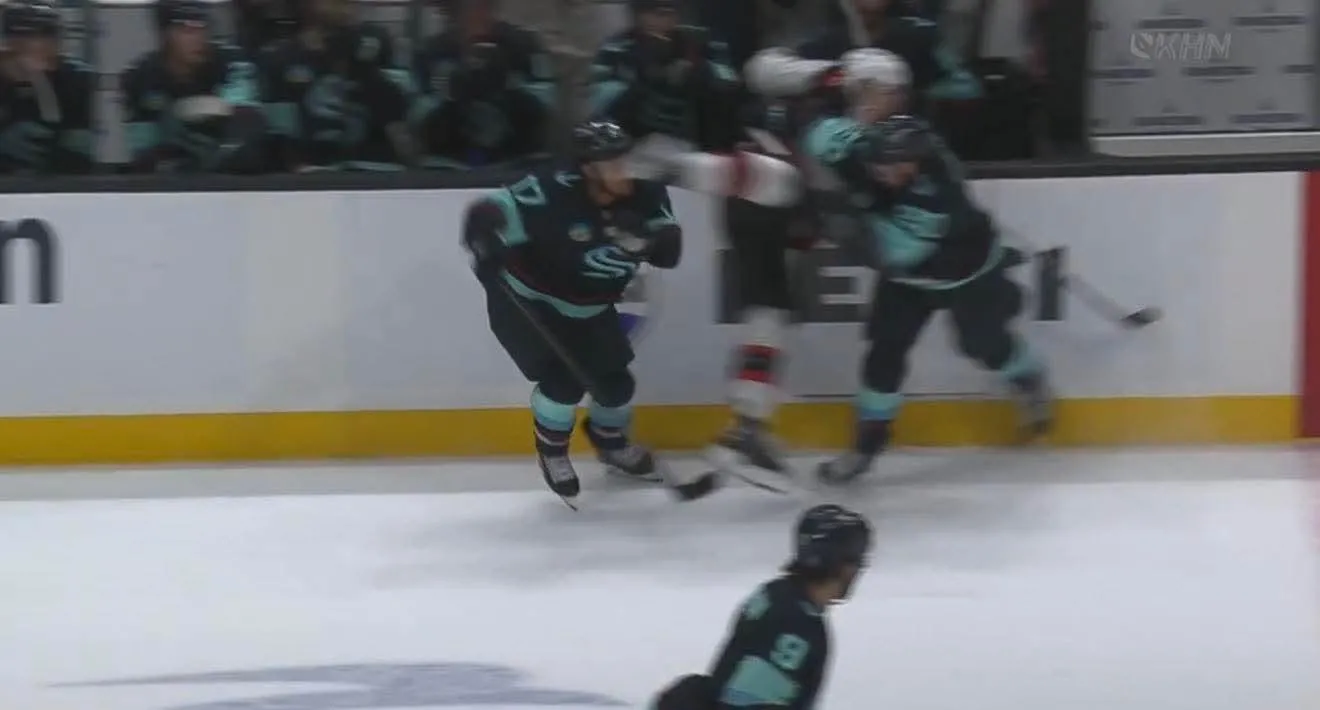 Seattle Kraken forward Jaden Schwartz being hit in the face by the skate of Senators forward Nick Cousins
