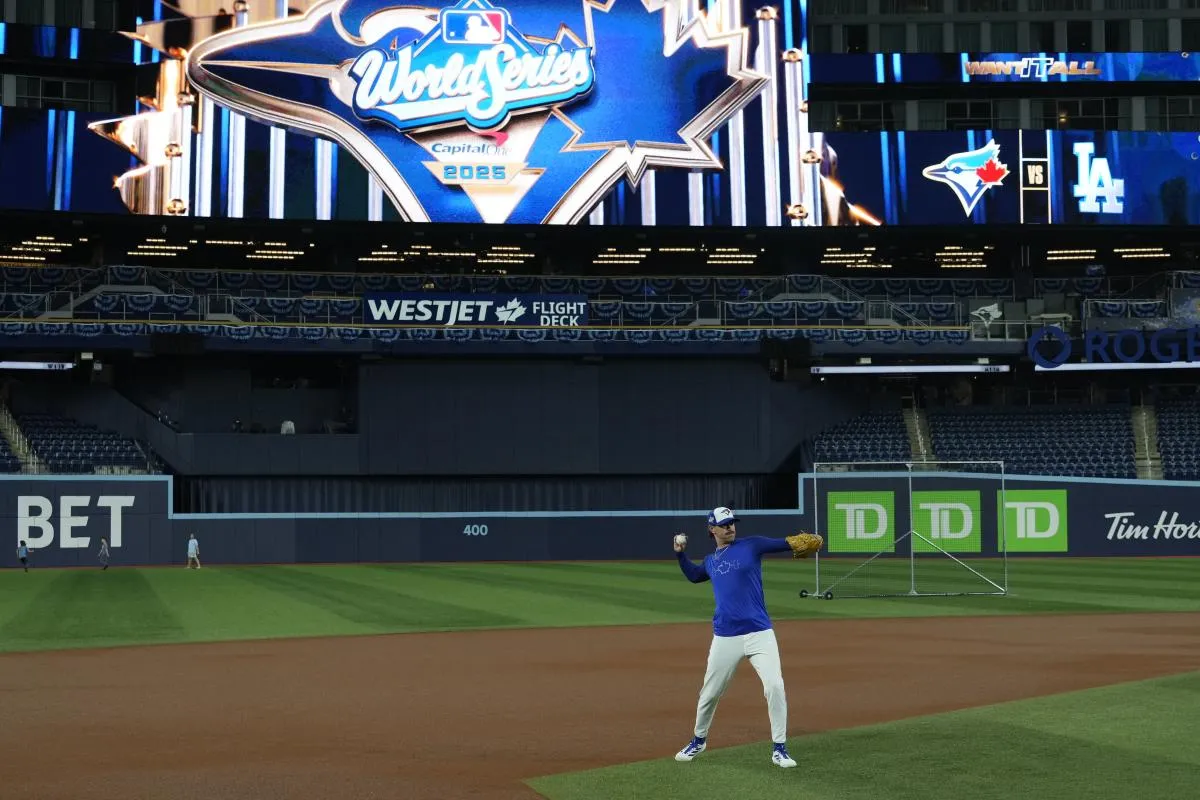 Toronto Blue Jays pitcher Shane Bieber (57) throws a ball during batting pratice on during media day before game one of the World Series at Rogers Centre.