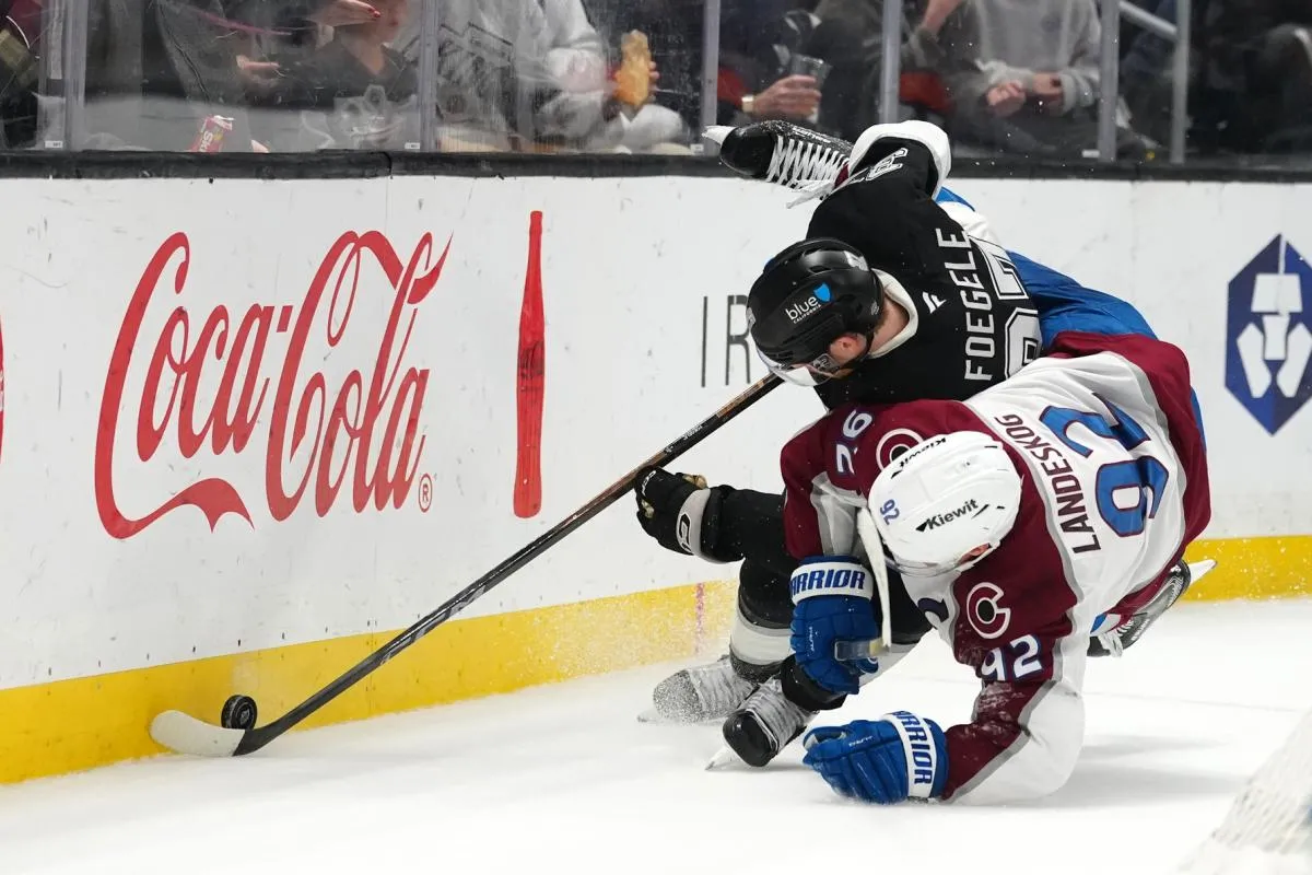 LA Kings left wing Warren Foegele (37)and Colorado Avalanche left wing Gabriel Landeskog (92) battle for the puck in the third period at Crypto.com Arena.