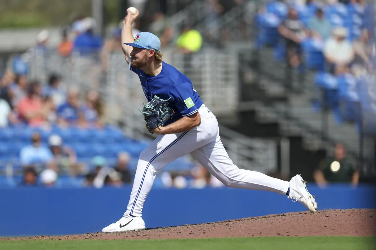 Toronto Blue Jays pitcher Spencer Miles (62) throws a pitch against the Detroit Tigers in the eighth inning during spring training at TD Ballpark.