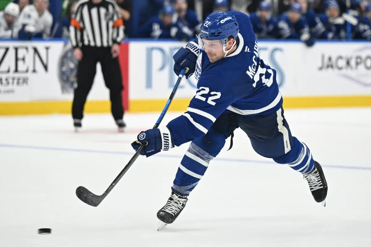 Toronto Maple Leafs defenseman Jake McCabe (22) hits a slapshot against the Tampa Bay Lightning in the third period at Scotiabank Arena.