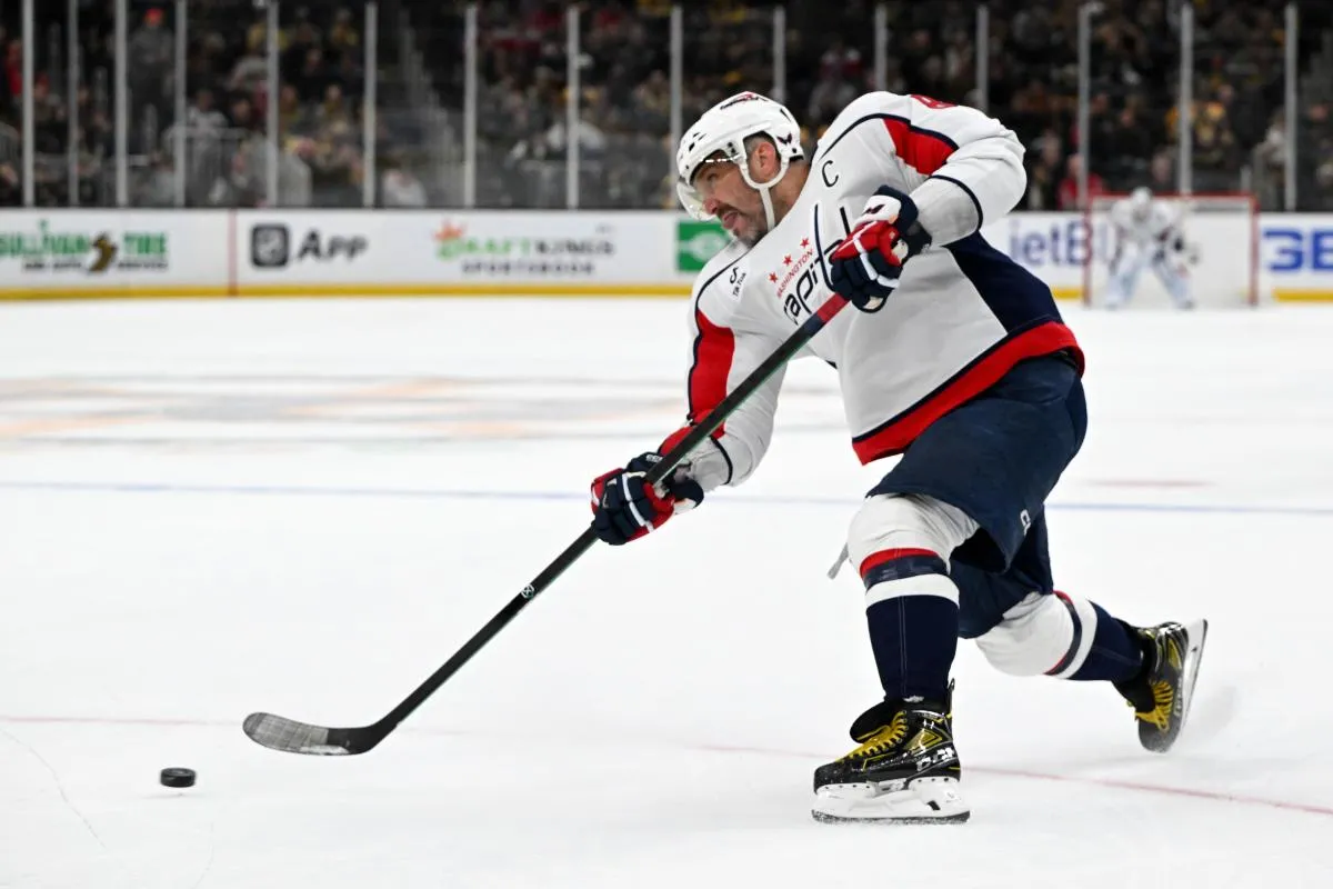 Washington Capitals left wing Alex Ovechkin (8) attempts a shot against the Boston Bruins during the second period at the TD Garden.